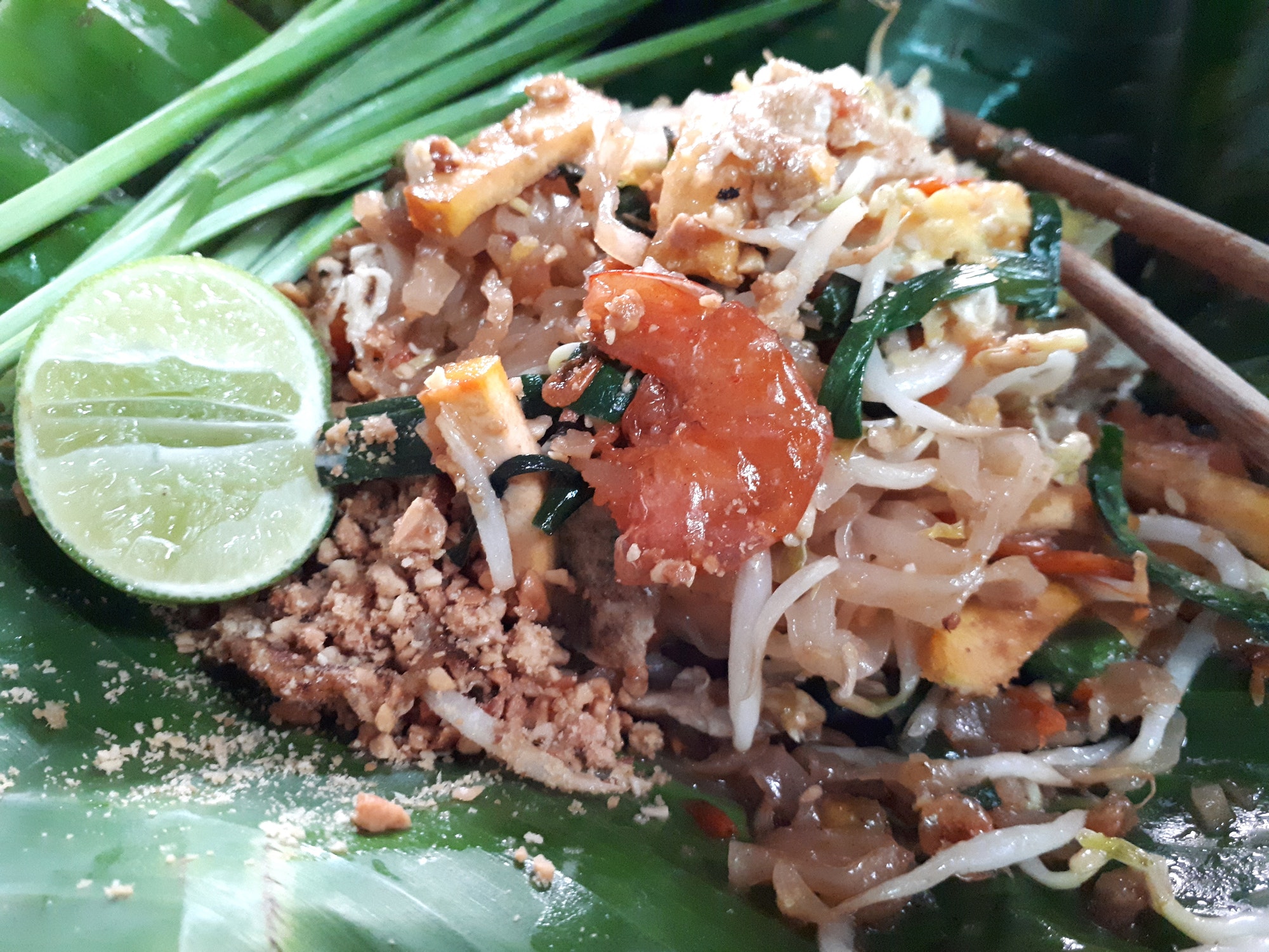 Close up Pad Thai on banana leaf with egg and dried shrimp, Street food, Thailand