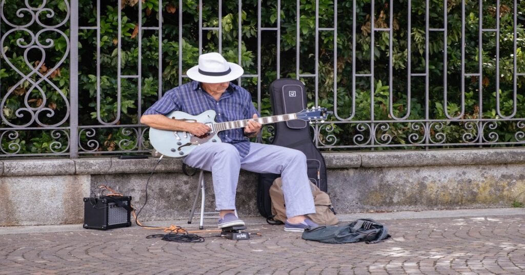 Guests gathered around a table at an Italian farm-stay singing with a guitar player in a rustic dining room