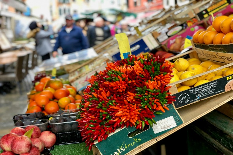 Italian outdoor market with fresh produce stalls