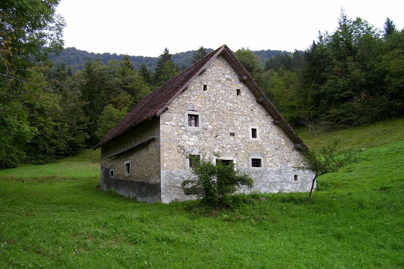 Rustic stone farmhouse with wooden beams in the Friuli countryside