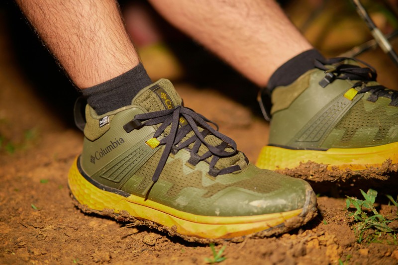 A pair of sturdy waterproof hiking boots standing on a forest path in Umbria